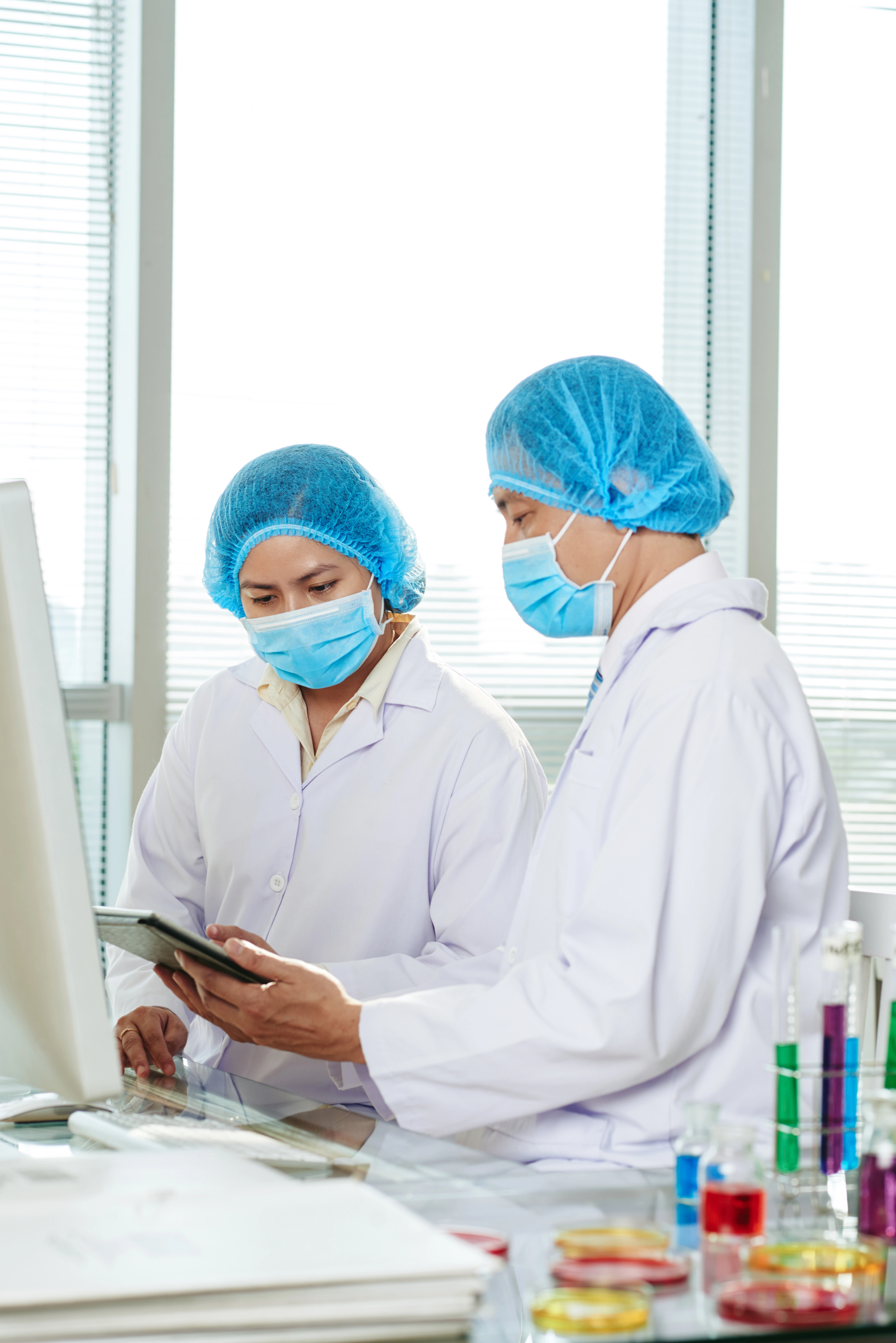 Scientist working with precision equipment in a medical laboratory.